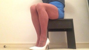 Sitting without panties in tan pantyhose .